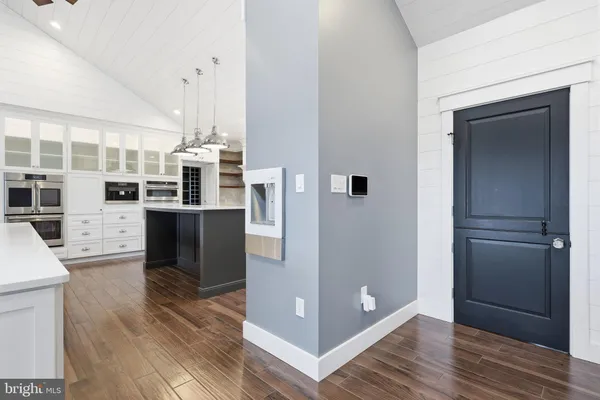 a room with a fireplace and wooden floor