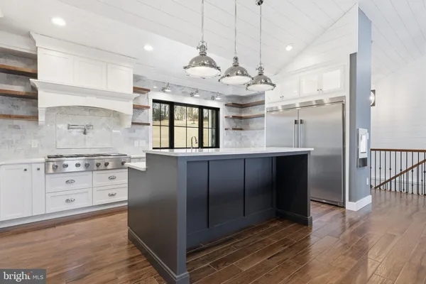 a view of swimming pool with outdoor seating and city view