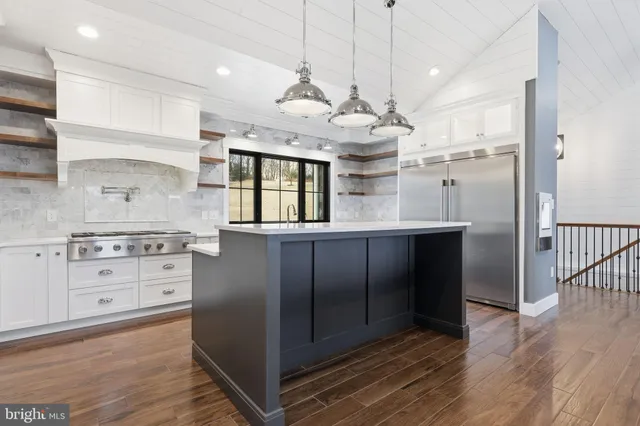 a view of swimming pool with outdoor seating and city view
