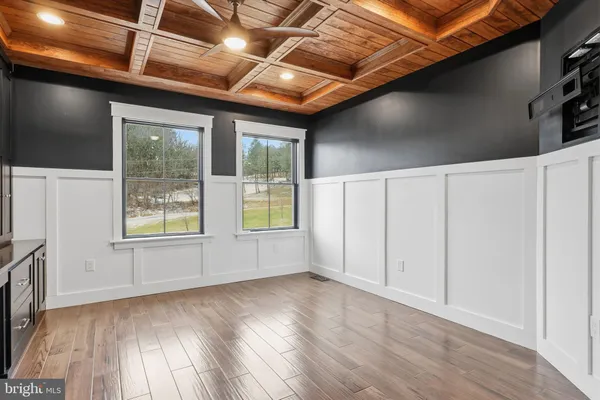 a bathroom with a sink vanity granite shower and a mirror