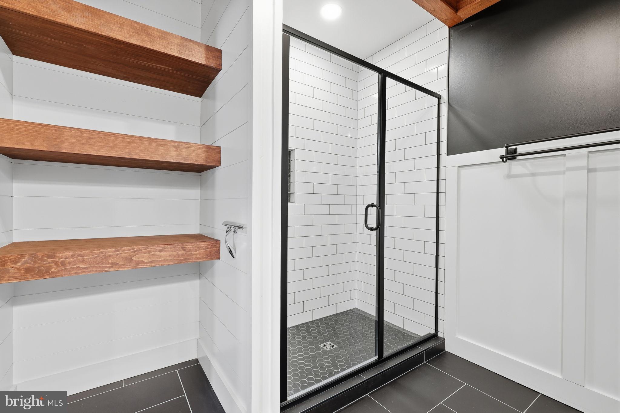 176 Fenstermaker Road Kutztown, PA 19530 - Photo 95 of 149 Sleek modern shower with stylish wood accents.