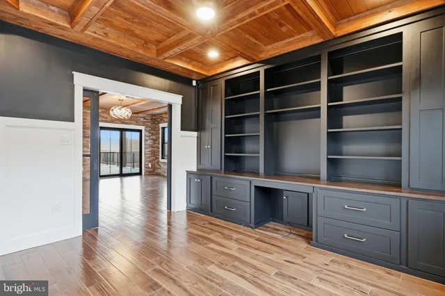 a bathroom with a sink a toilet a mirror and shower