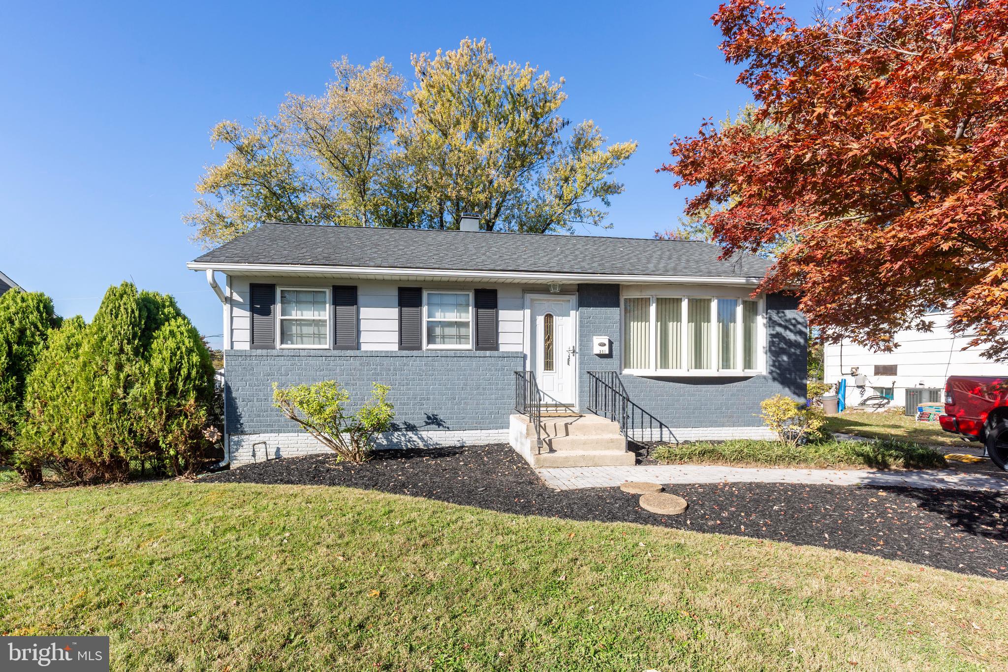 318 Bryanstone Road Reisterstown, MD 21136 - Photo 1 of 36 a front view of a house with a yard