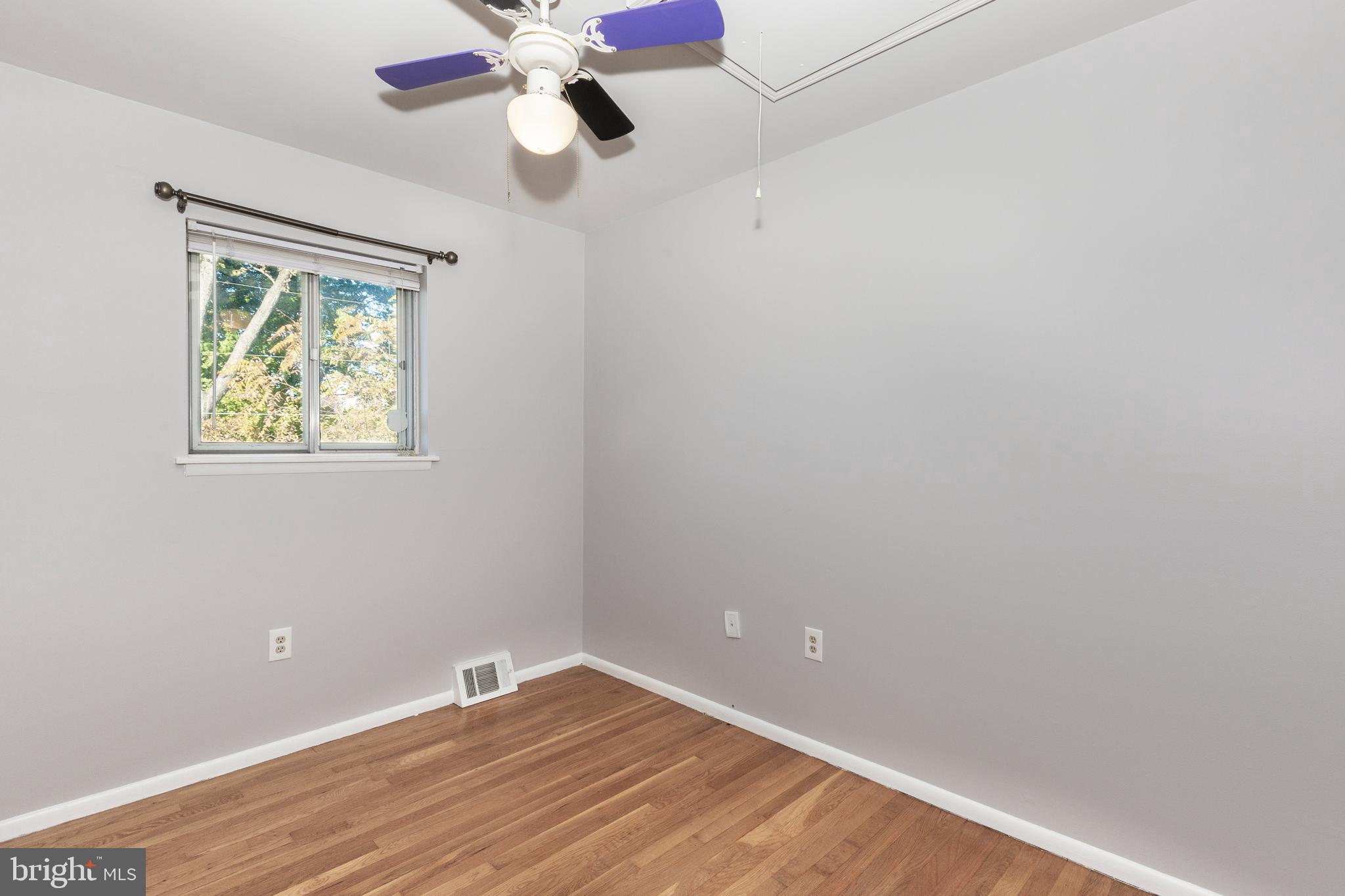 318 Bryanstone Road Reisterstown, MD 21136 - Photo 11 of 36 an empty room with a window and a fan