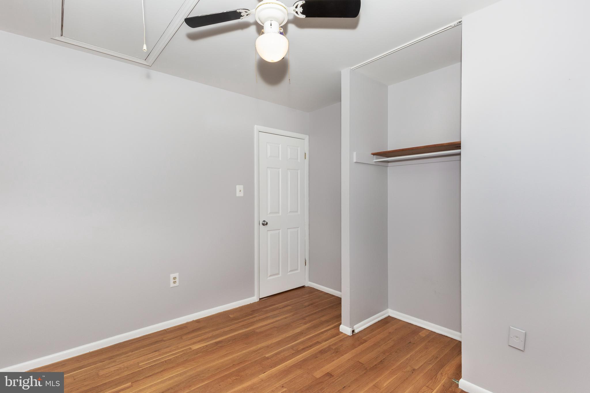 318 Bryanstone Road Reisterstown, MD 21136 - Photo 13 of 36 a view of an empty room with wooden floor