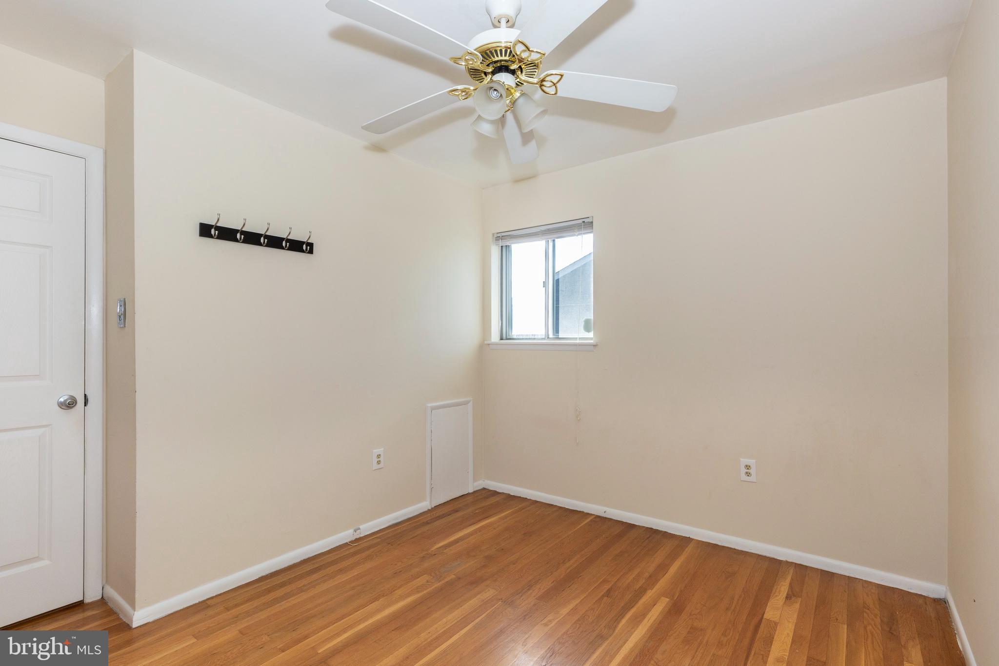 318 Bryanstone Road Reisterstown, MD 21136 - Photo 15 of 36 wooden floor in an empty room with a window