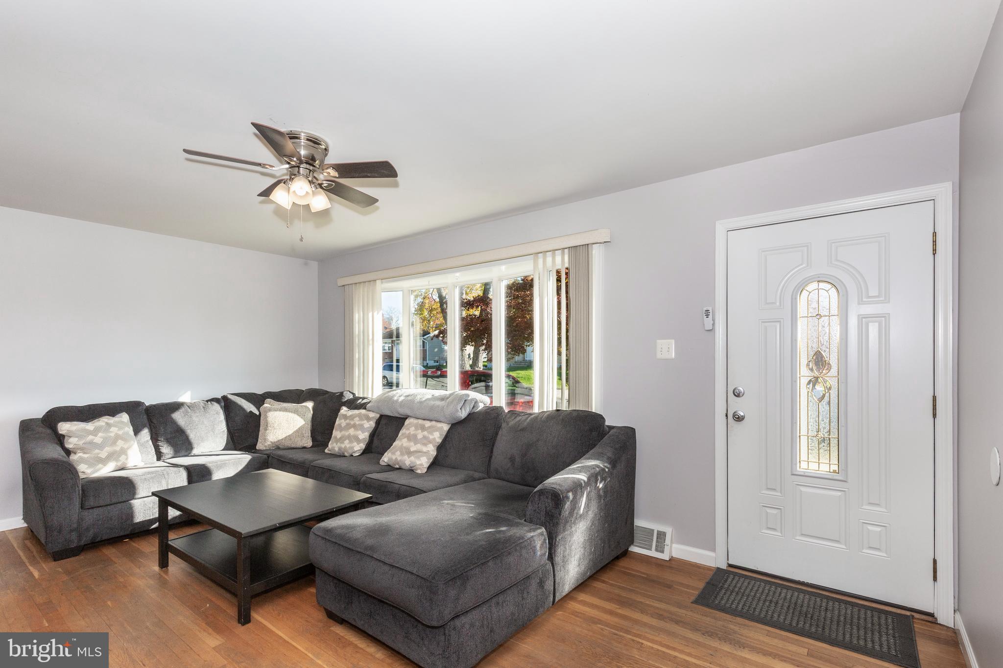 318 Bryanstone Road Reisterstown, MD 21136 - Photo 3 of 36 a living room with furniture and wooden floor