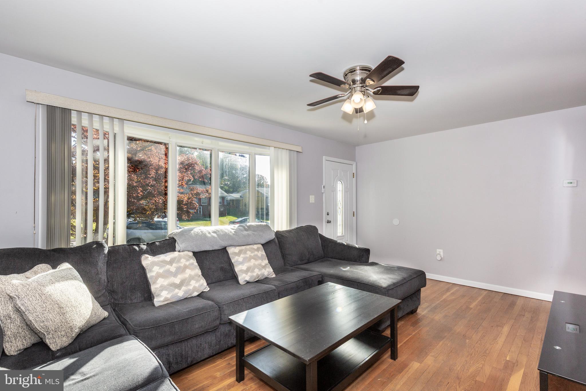 318 Bryanstone Road Reisterstown, MD 21136 - Photo 4 of 36 a living room with furniture and a large window