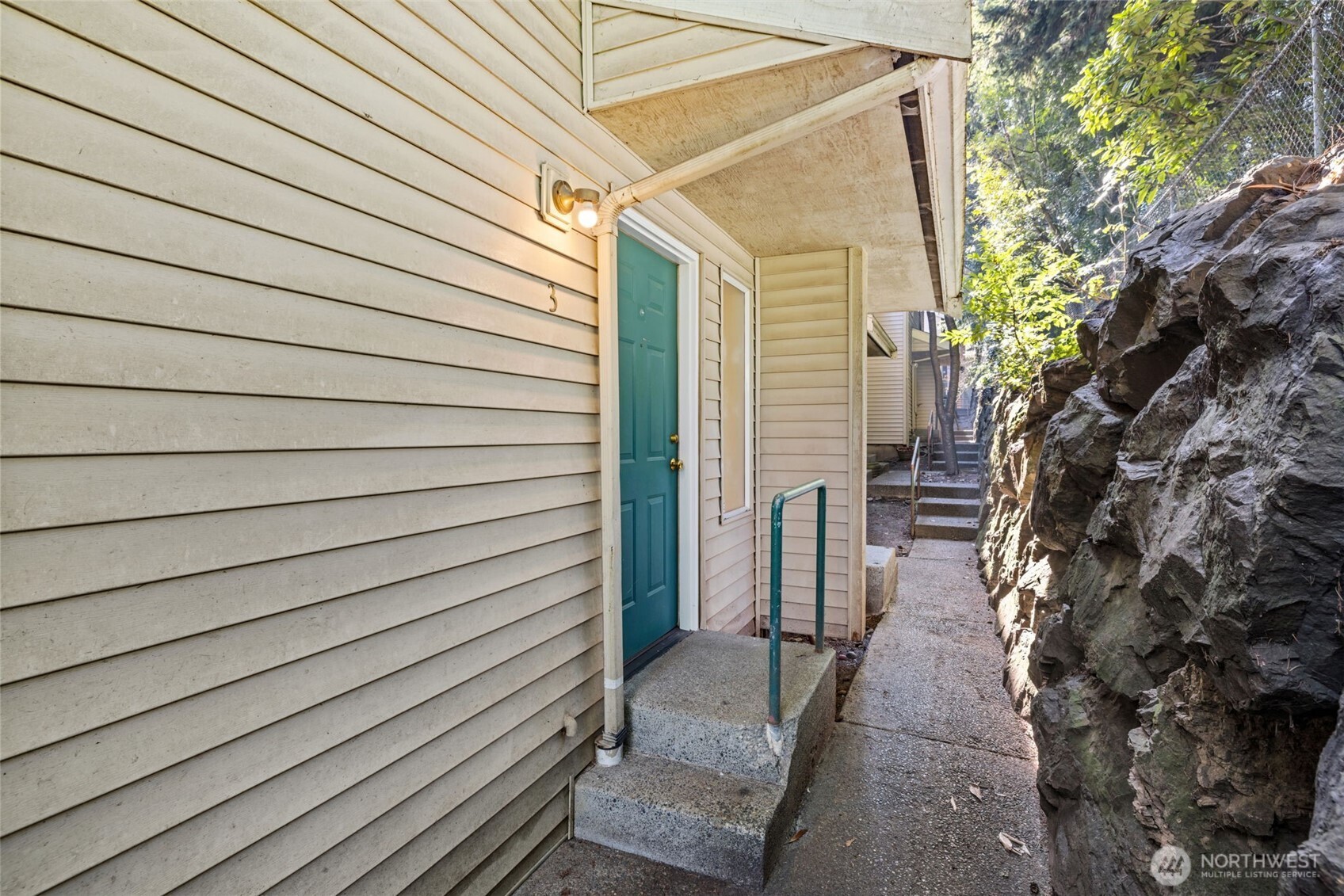 8512 242nd Street Southwest, Unit 3 Edmonds, WA 98026 - Photo 2 of 32 a view of a house with a backyard