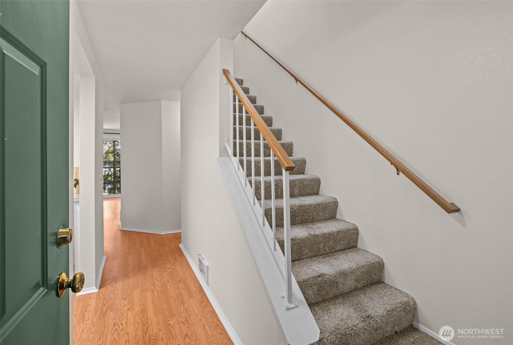 8512 242nd Street Southwest, Unit 3 Edmonds, WA 98026 - Photo 3 of 32 a view of entryway and hall with wooden floor