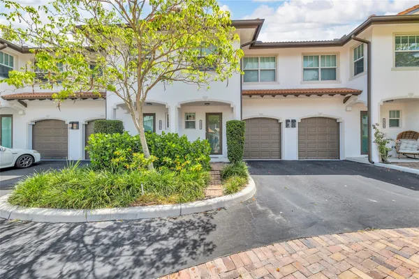 front view of a house with a garden