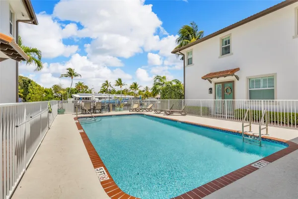 a view of swimming pool with a lounge chair