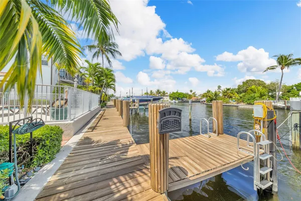 a view of a lake with couches and city view
