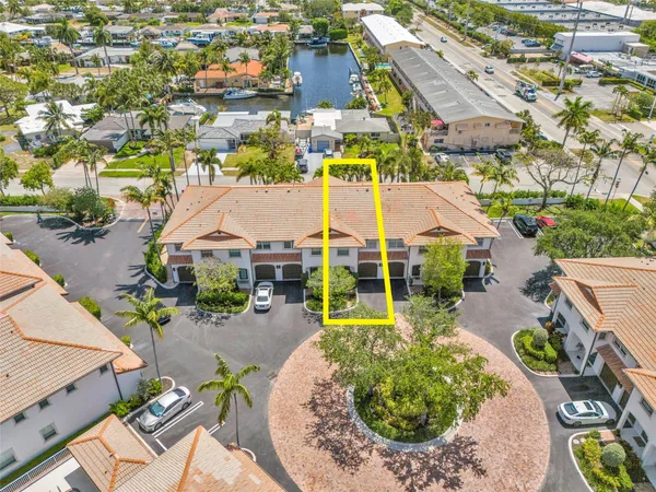 an aerial view of a house with a swimming pool