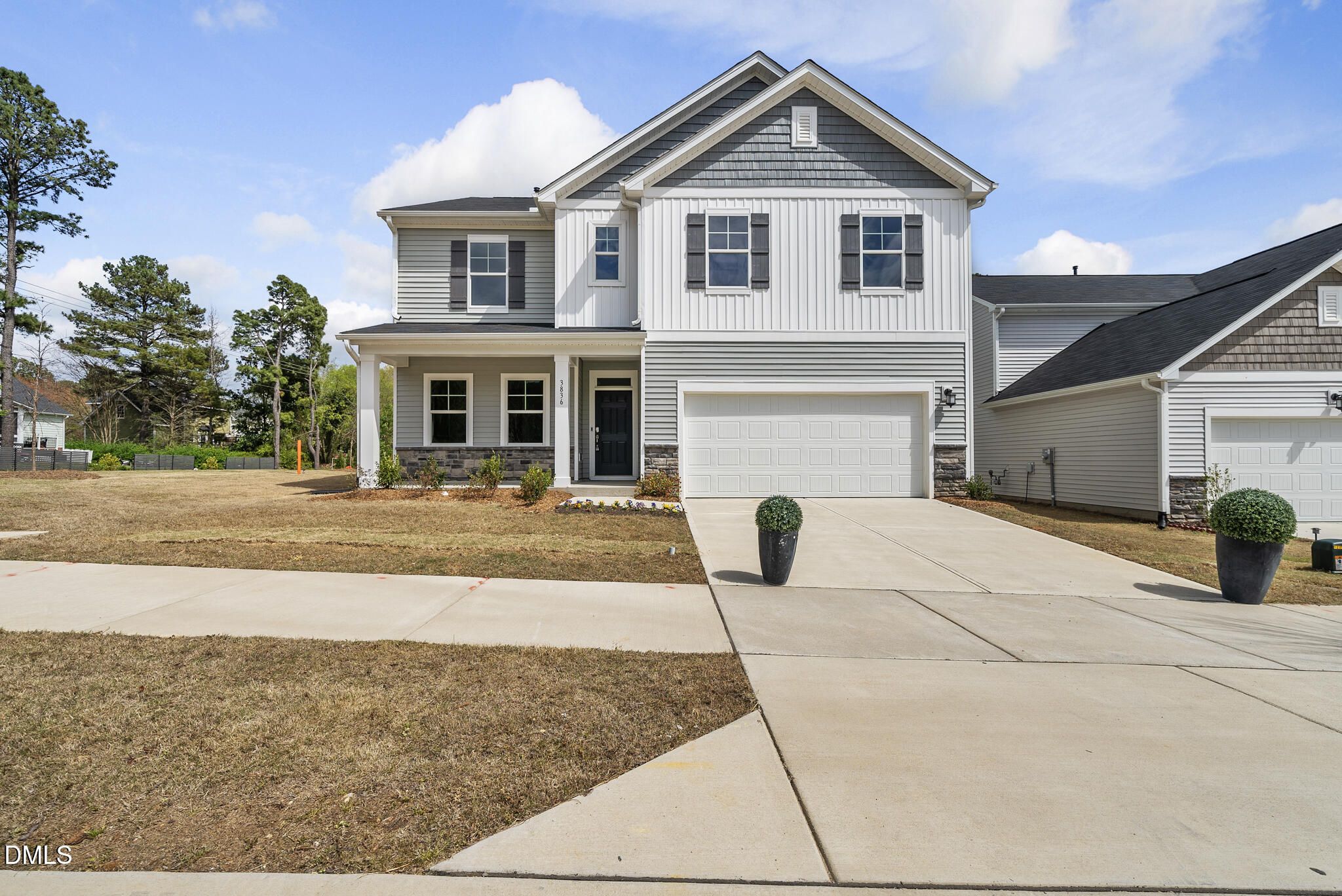 3836 Mason Blf Drive Raleigh, NC 27616 - Photo 1 of 37 a front view of a house with a yard and garage