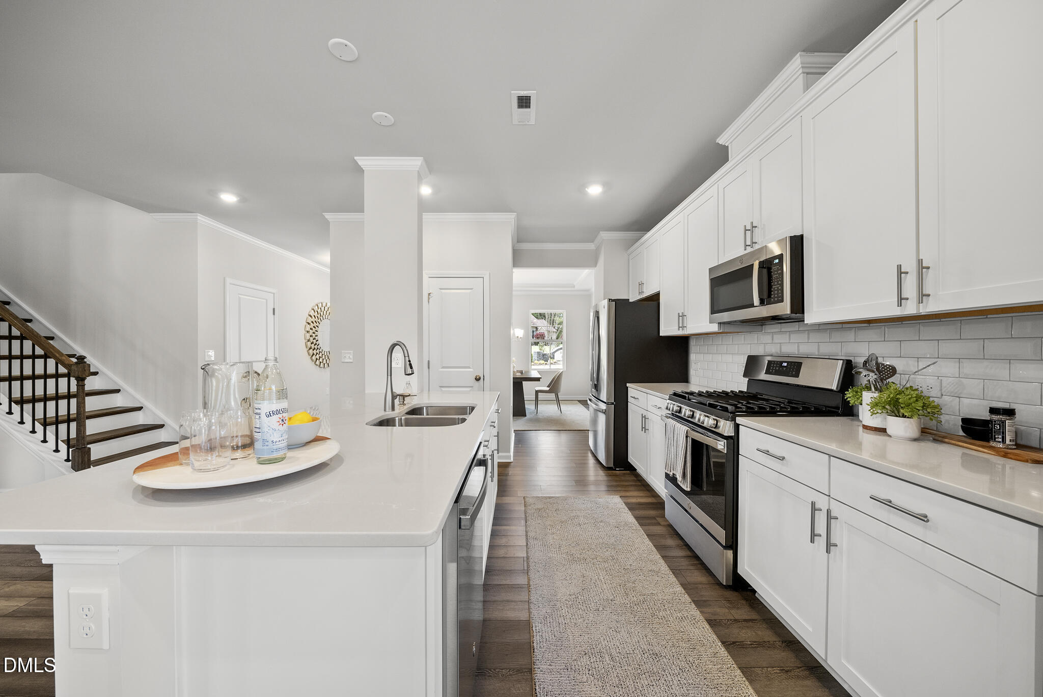 3836 Mason Blf Drive Raleigh, NC 27616 - Photo 10 of 37 a large kitchen with stainless steel appliances lots of counter space and breakfast area