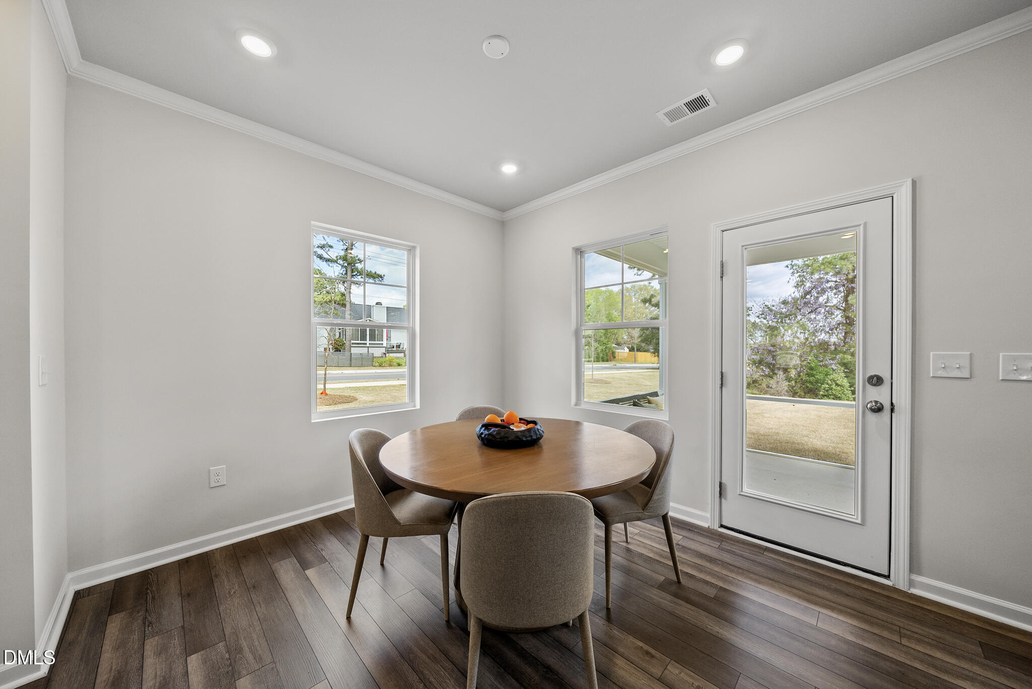 3836 Mason Blf Drive Raleigh, NC 27616 - Photo 13 of 37 a dining room with furniture and wooden floor
