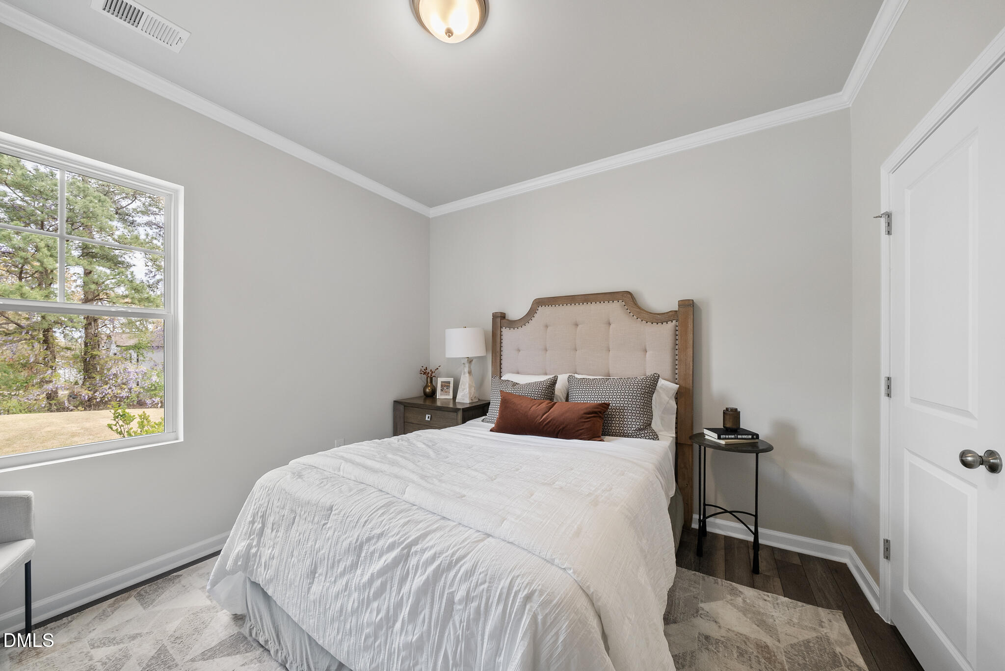 3836 Mason Blf Drive Raleigh, NC 27616 - Photo 21 of 37 a bedroom with a bed and a window