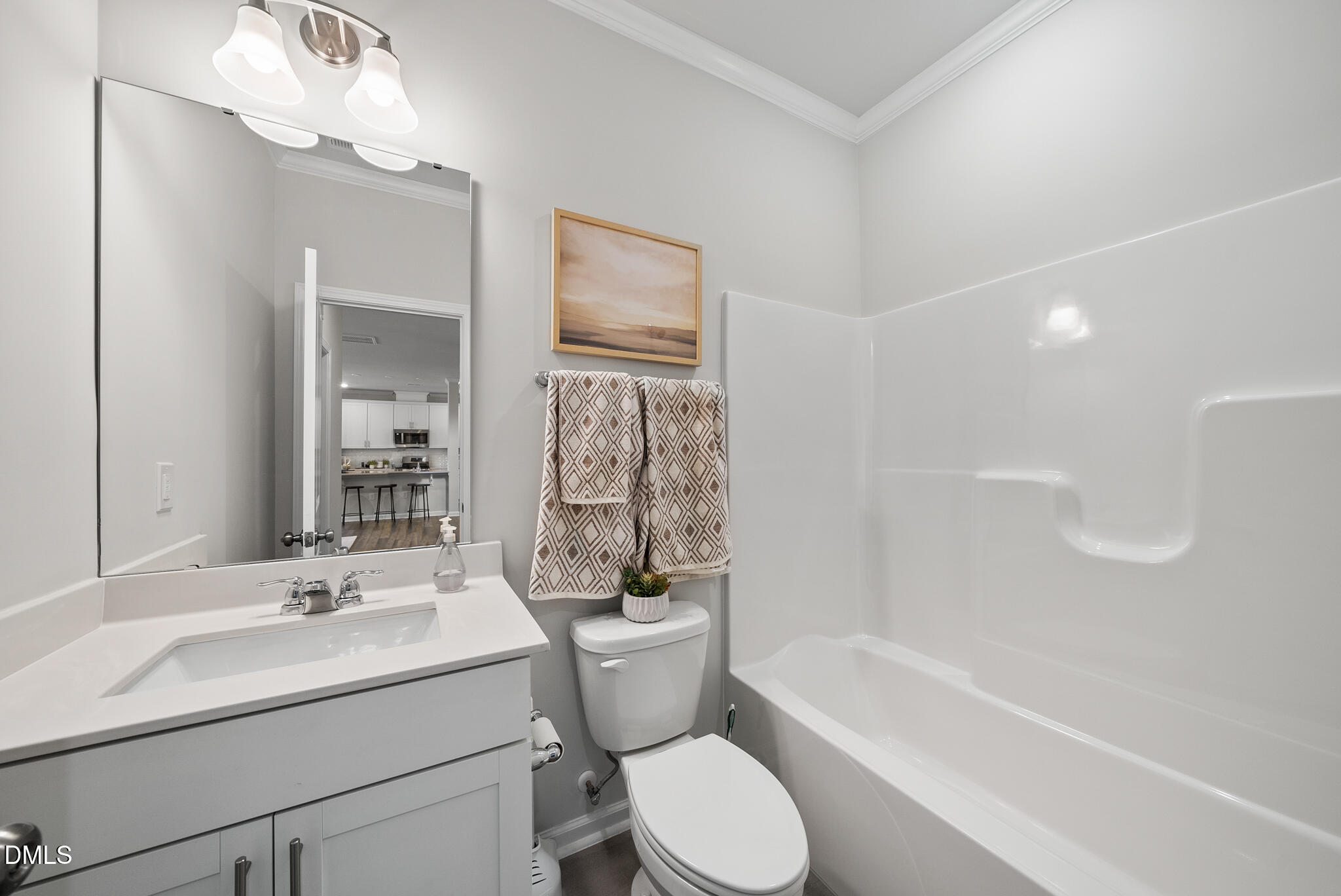 3836 Mason Blf Drive Raleigh, NC 27616 - Photo 22 of 37 a bathroom with a sink a toilet and bathtub
