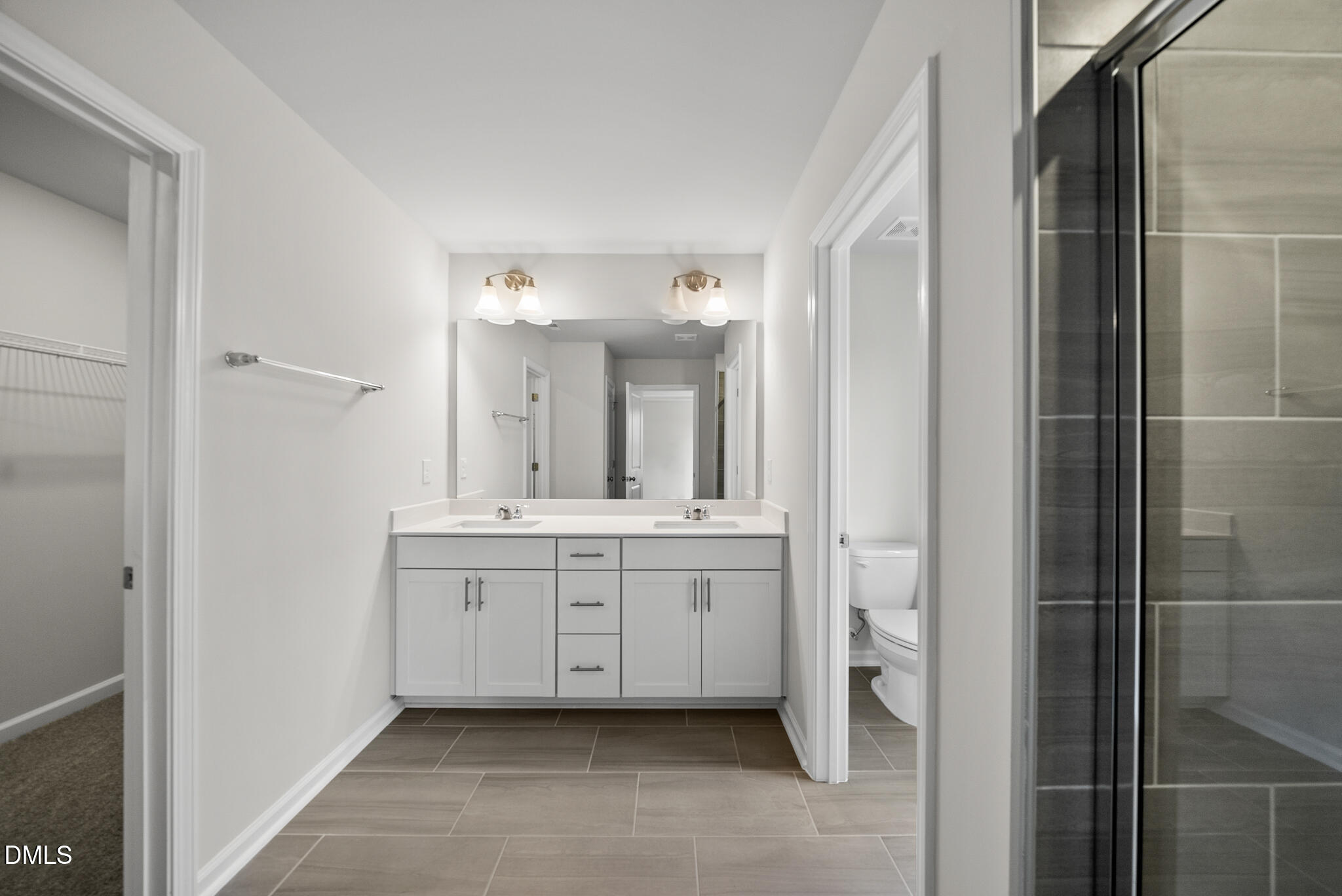3836 Mason Blf Drive Raleigh, NC 27616 - Photo 25 of 37 a spacious bathroom with a mirror sink and double
