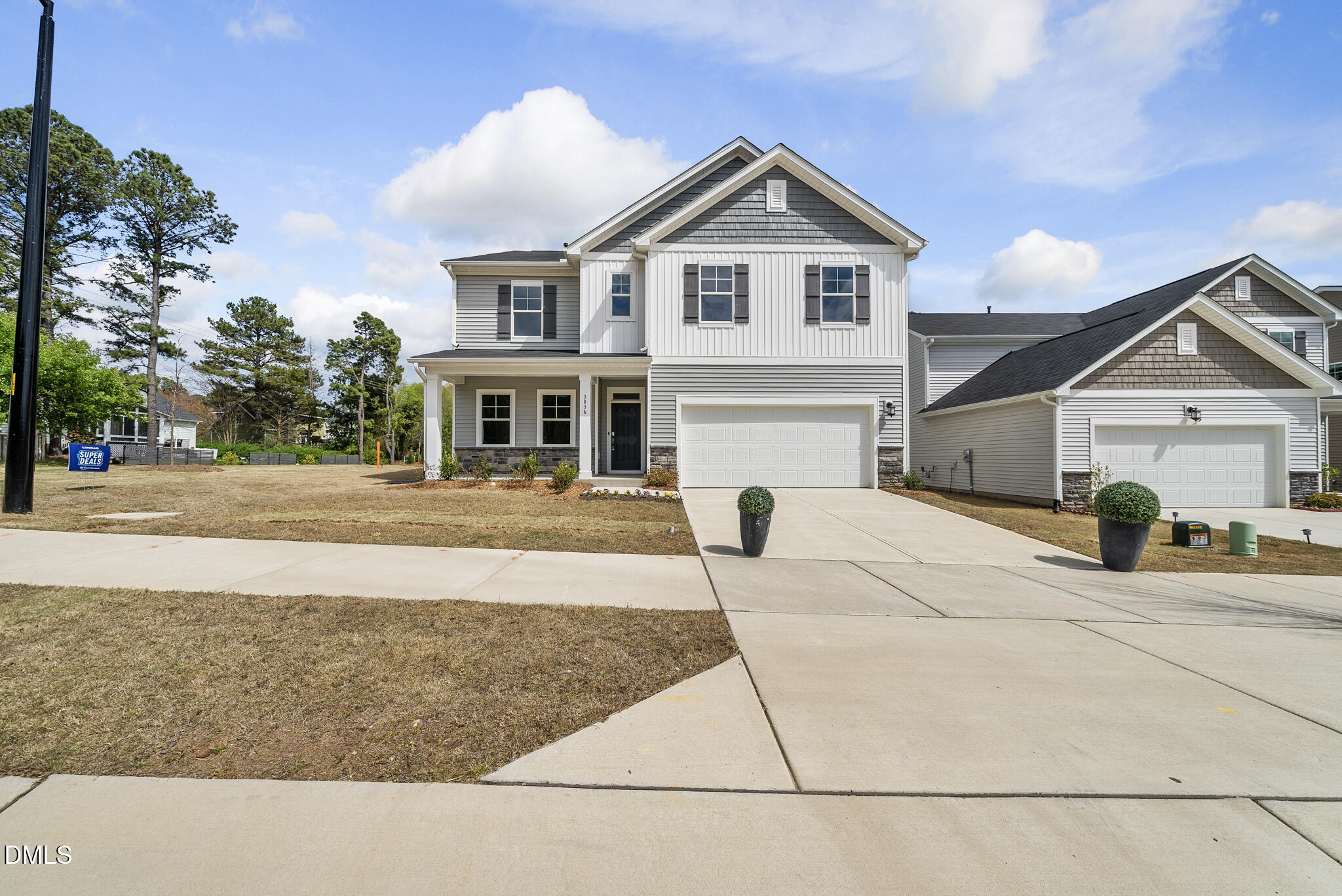 3836 Mason Blf Drive Raleigh, NC 27616 - Photo 34 of 37 a front view of a house with a yard and garage