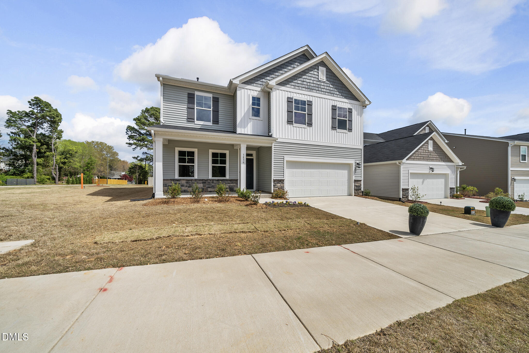 3836 Mason Blf Drive Raleigh, NC 27616 - Photo 35 of 37 a front view of a house with a yard and garage