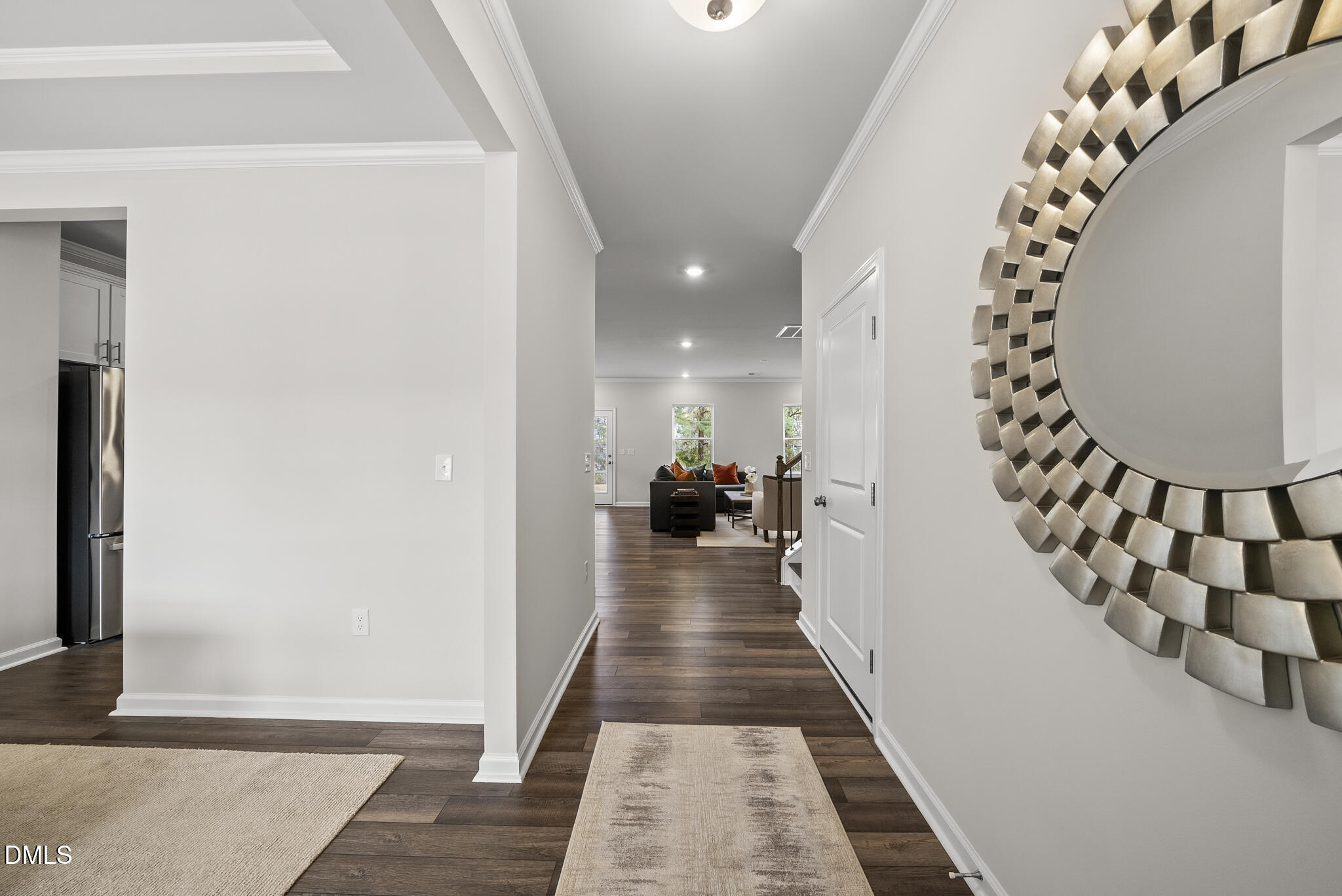 3836 Mason Blf Drive Raleigh, NC 27616 - Photo 5 of 37 a view of a hallway with wooden floor and staircase