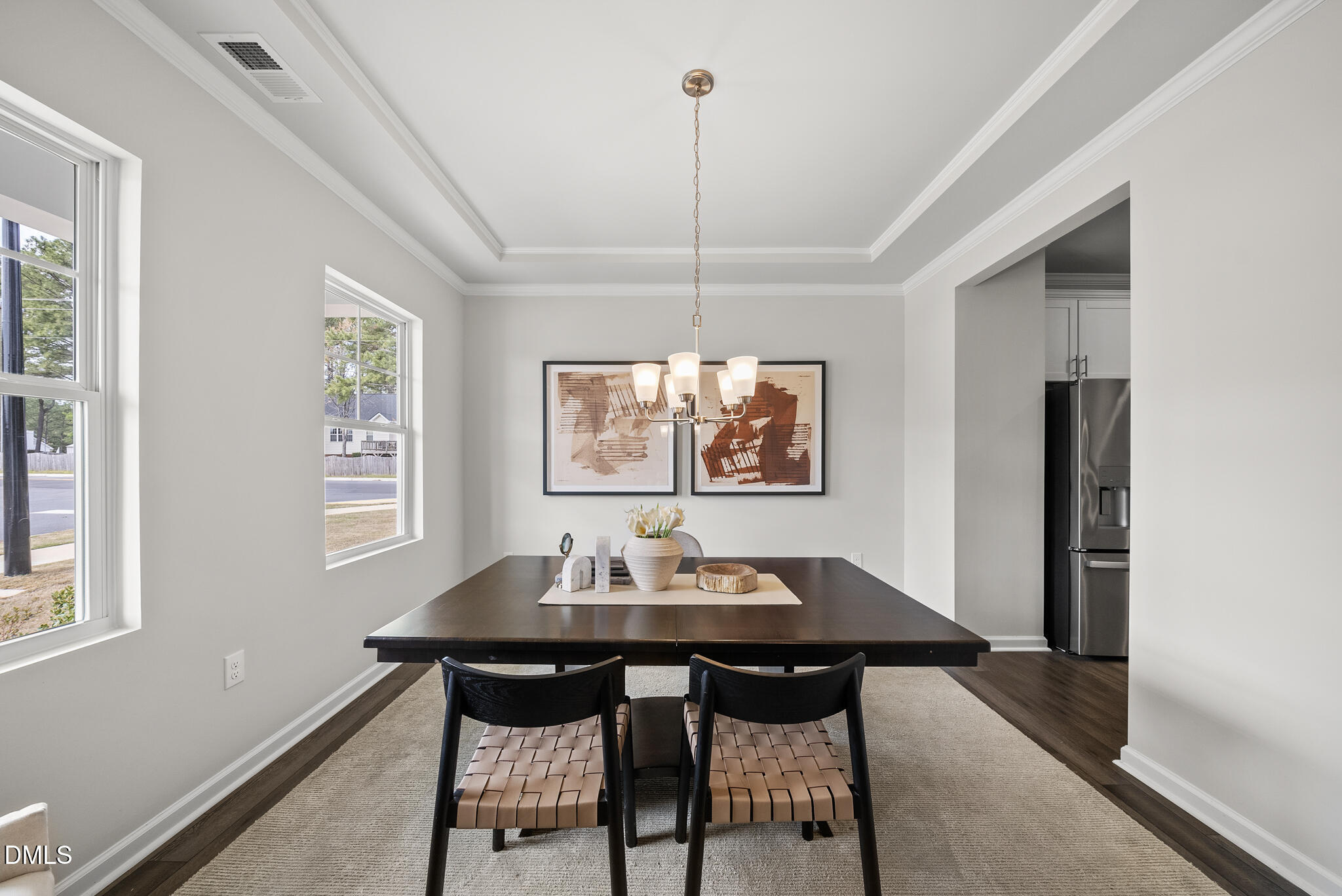 3836 Mason Blf Drive Raleigh, NC 27616 - Photo 7 of 37 a view of a dining room with a table and chairs