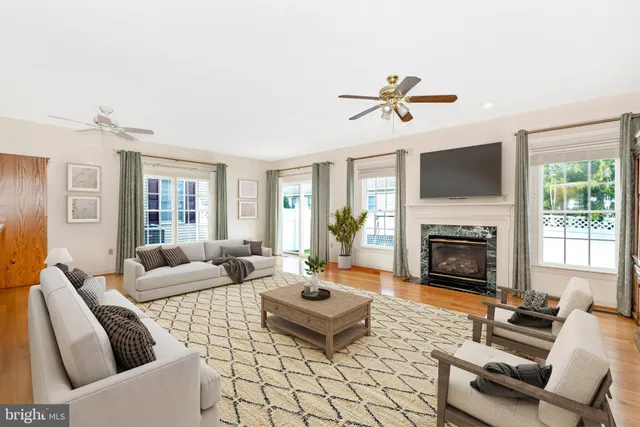 a living room with furniture fireplace and a flat screen tv