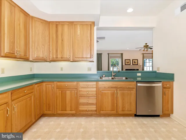 a kitchen with stainless steel appliances granite countertop a sink and a granite counter tops