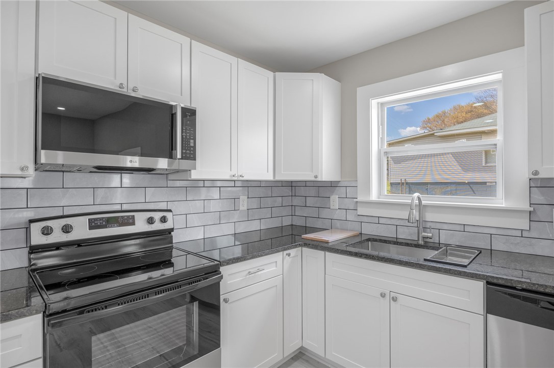 2 Allen Street Pelzer, SC 29669 - Photo 11 of 25 This newly renovated kitchen features sleek countertops, pristine cabinetry, and modern appliances.
