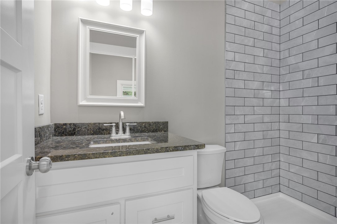 2 Allen Street Pelzer, SC 29669 - Photo 12 of 25 This bathroom features a contemporary vanity and subway tile, creating a sleek and functional space.