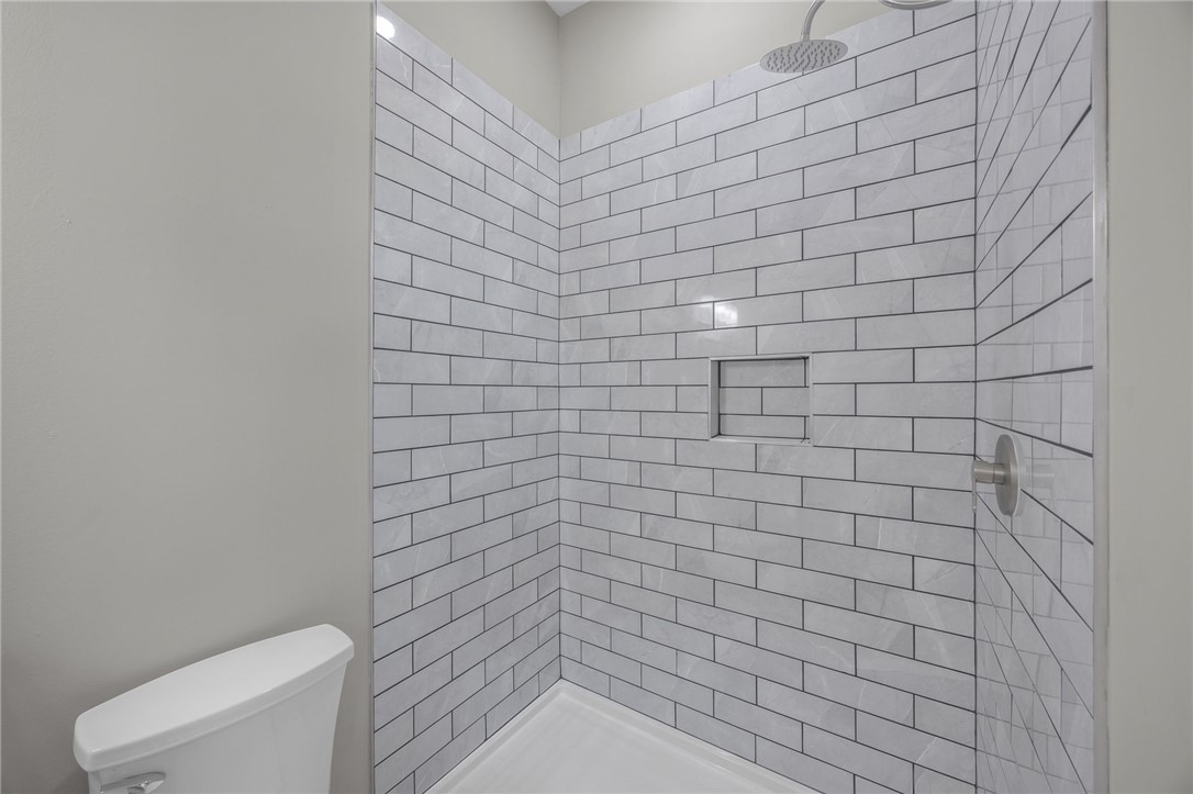 2 Allen Street Pelzer, SC 29669 - Photo 13 of 25 This sleek shower features subway tile and a convenient recessed niche.