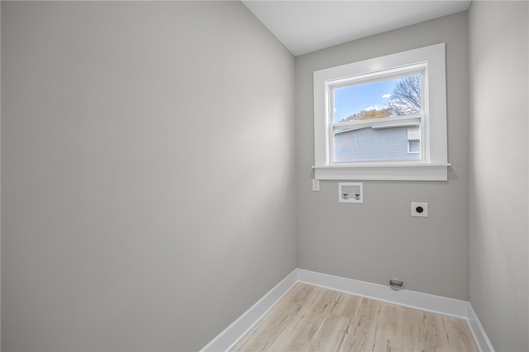 2 Allen Street Pelzer, SC 29669 - Photo 15 of 25 This bright laundry room offers practical utility and a fresh, clean aesthetic.