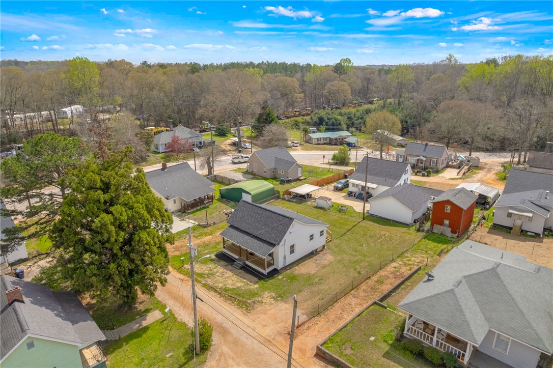 2 Allen Street Pelzer, SC 29669 - Photo 21 of 25 An aerial perspective reveals a vibrant neighborhood with diverse homes and mature trees.