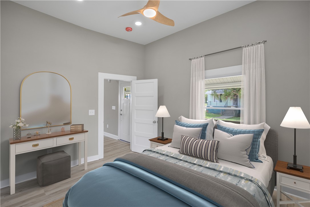 2 Allen Street Pelzer, SC 29669 - Photo 9 of 25 This cozy bedroom features high ceilings and a refreshing ceiling fan for comfort.