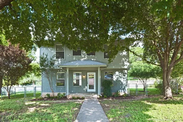 front view of a house with a yard