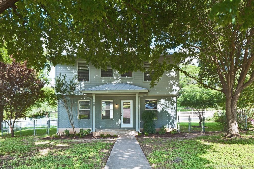 1601 East 10th Street Austin, TX 78702 - Photo 2 of 9 View of front of property featuring a gate and brick siding
