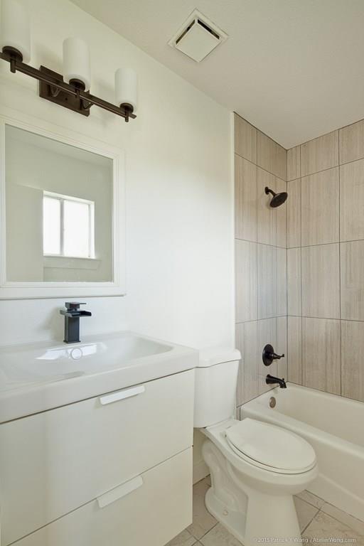 1601 East 10th Street Austin, TX 78702 - Photo 4 of 9 Full bathroom featuring vanity, light tile patterned floors, and shower / washtub combination