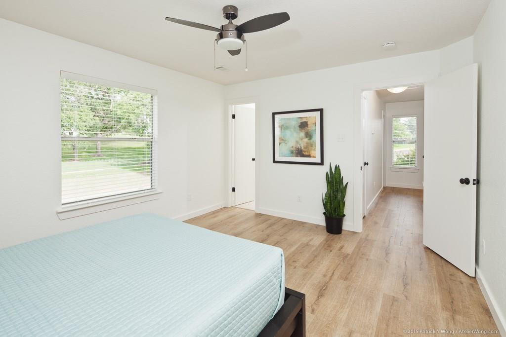 1601 East 10th Street Austin, TX 78702 - Photo 7 of 9 Bedroom with a ceiling fan and light wood finished floors