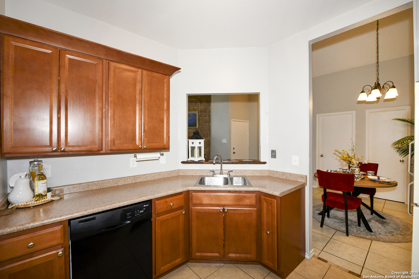 9536 Dover Ridge San Antonio, TX 78250 - Photo 5 of 9 a kitchen with a sink and a cabinets