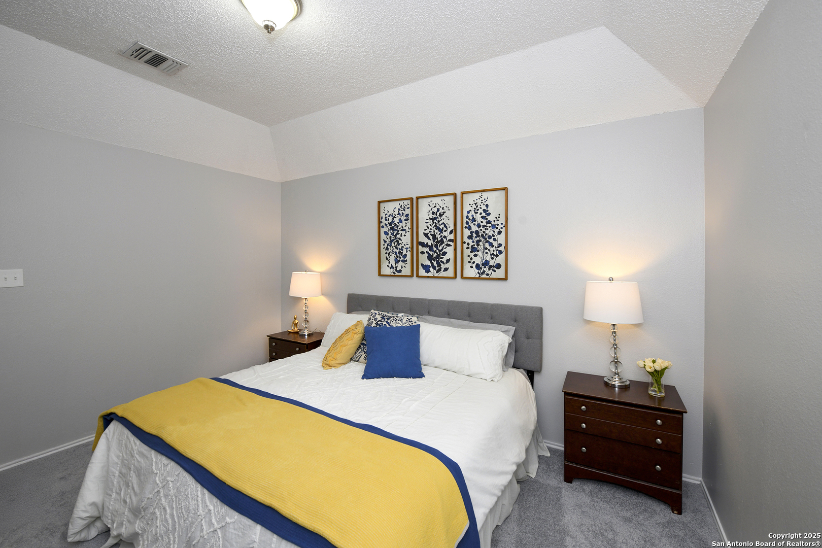 9536 Dover Ridge San Antonio, TX 78250 - Photo 7 of 9 a bedroom with a bed and a lamp on dresser