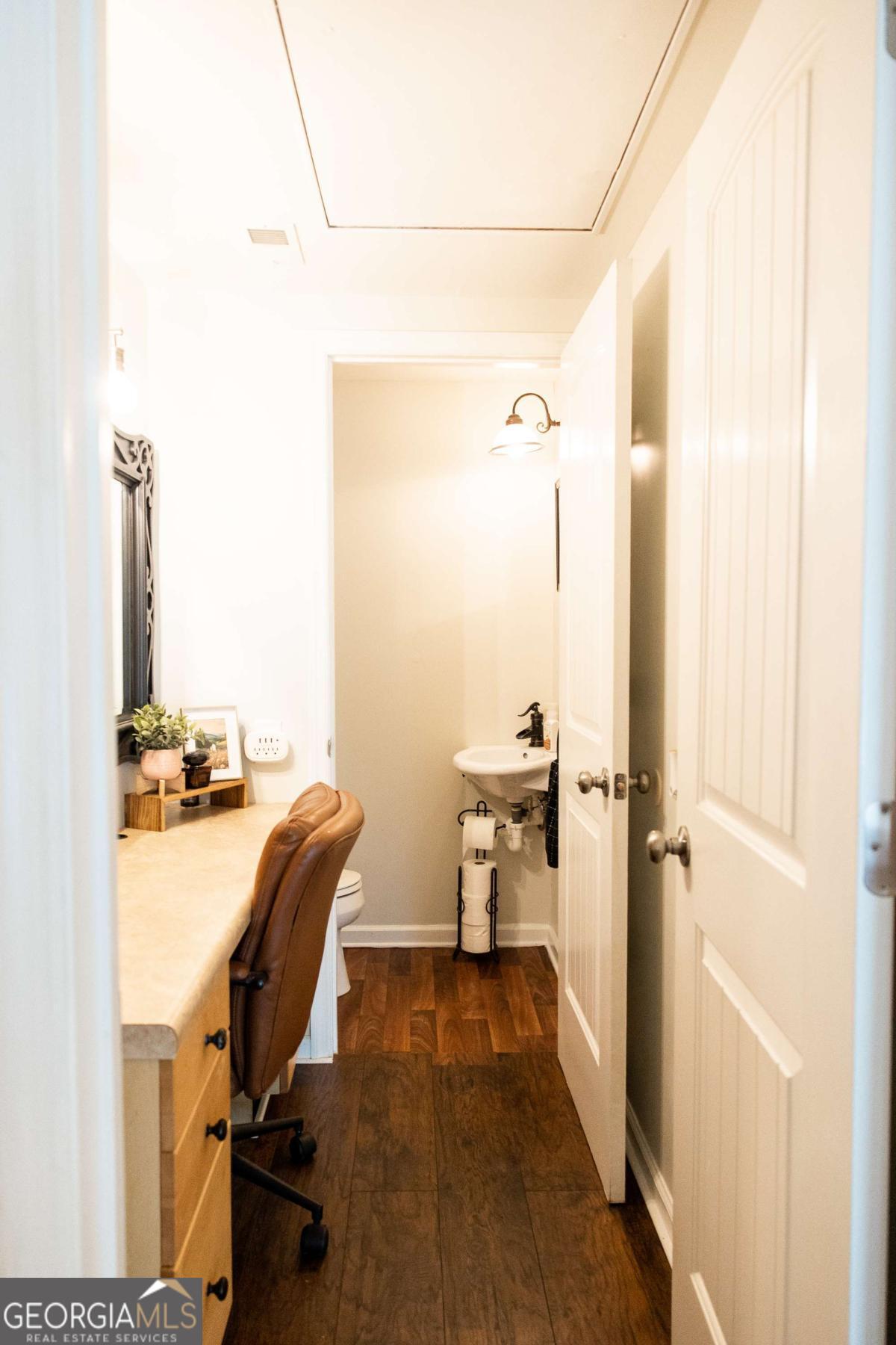 5720 N Highway Springfield, GA 31329 - Photo 13 of 27 a view of a workspace with furniture and a gate