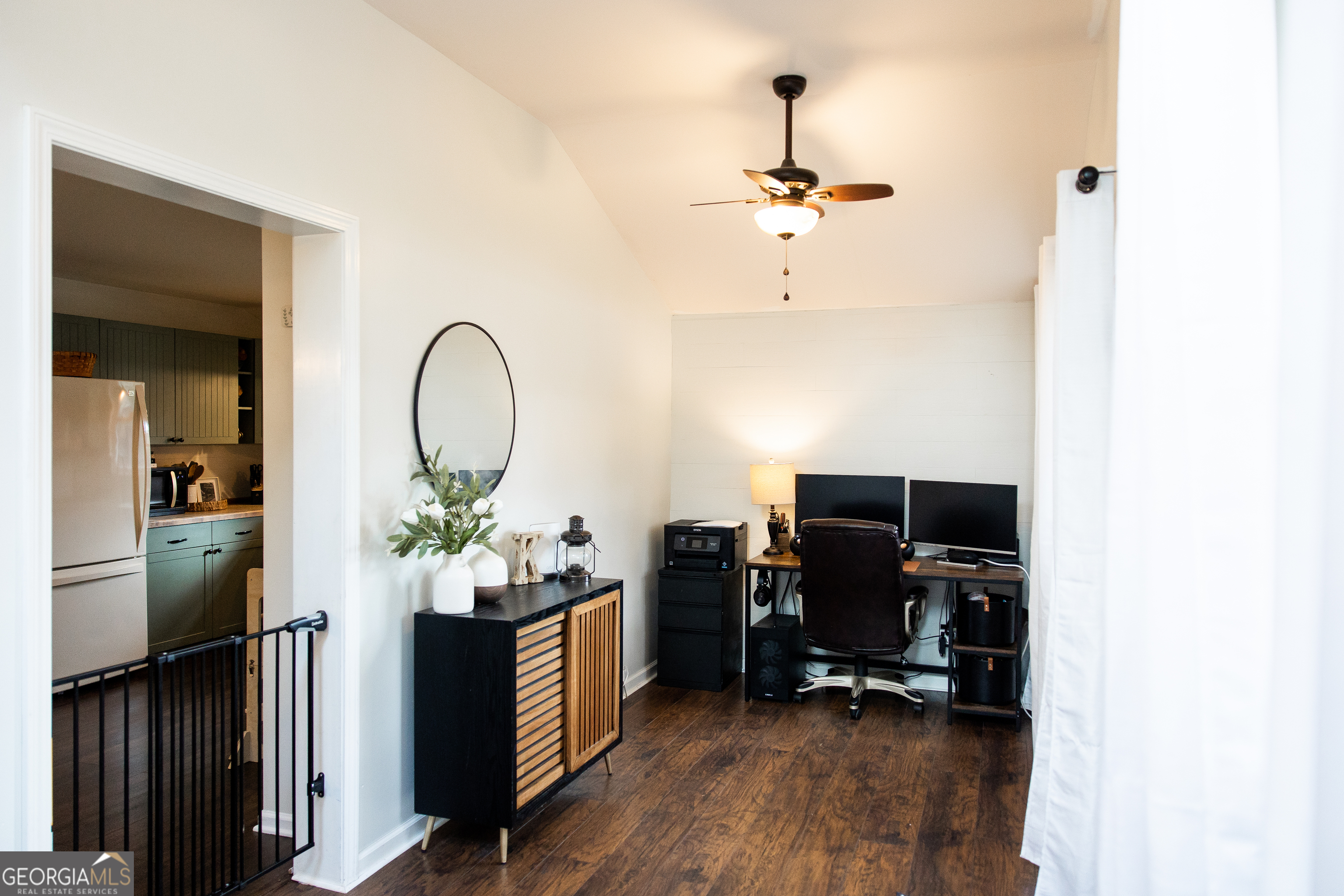 5720 N Highway Springfield, GA 31329 - Photo 5 of 27 a view of a workspace with furniture and wooden floor