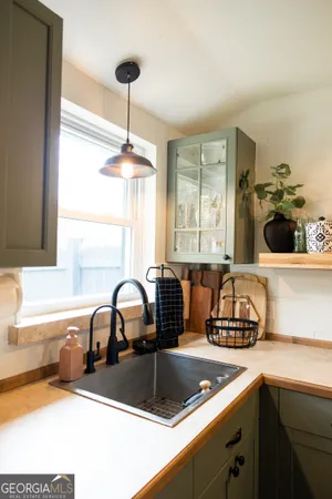 a kitchen with a sink and a stove