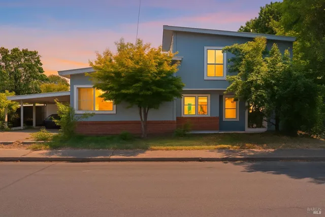 a view of a house with a yard