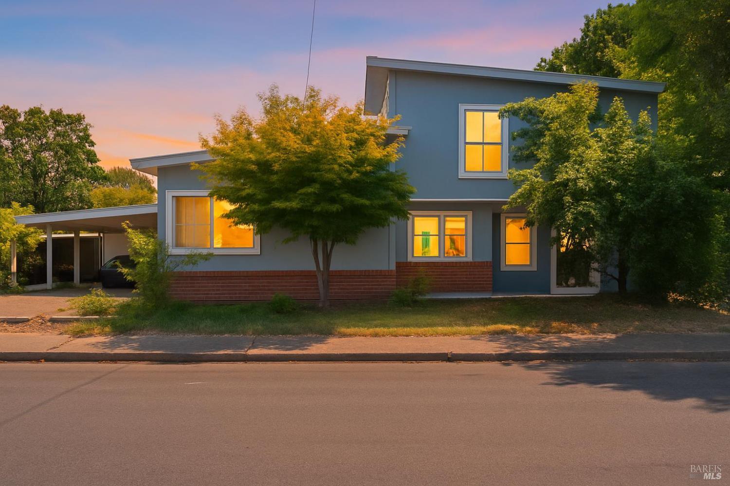 a view of a house with a yard