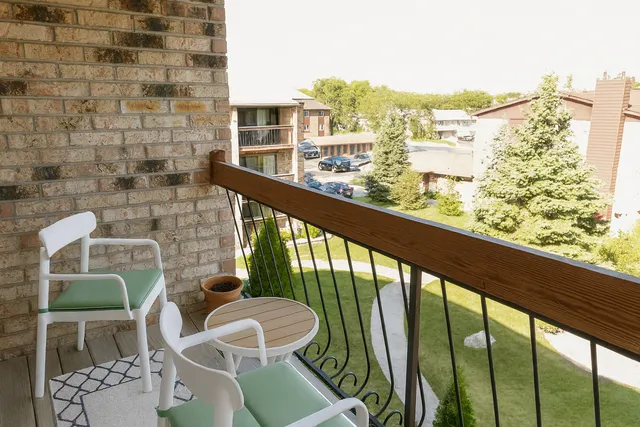 a view of a balcony with chairs