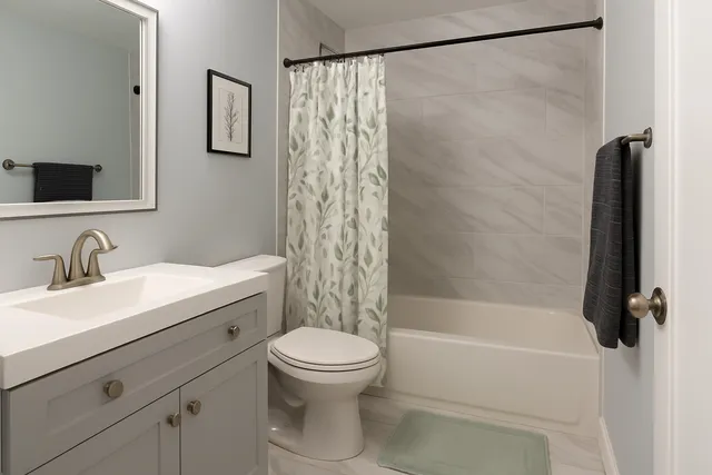 a bathroom with a sink a toilet and a bathtub