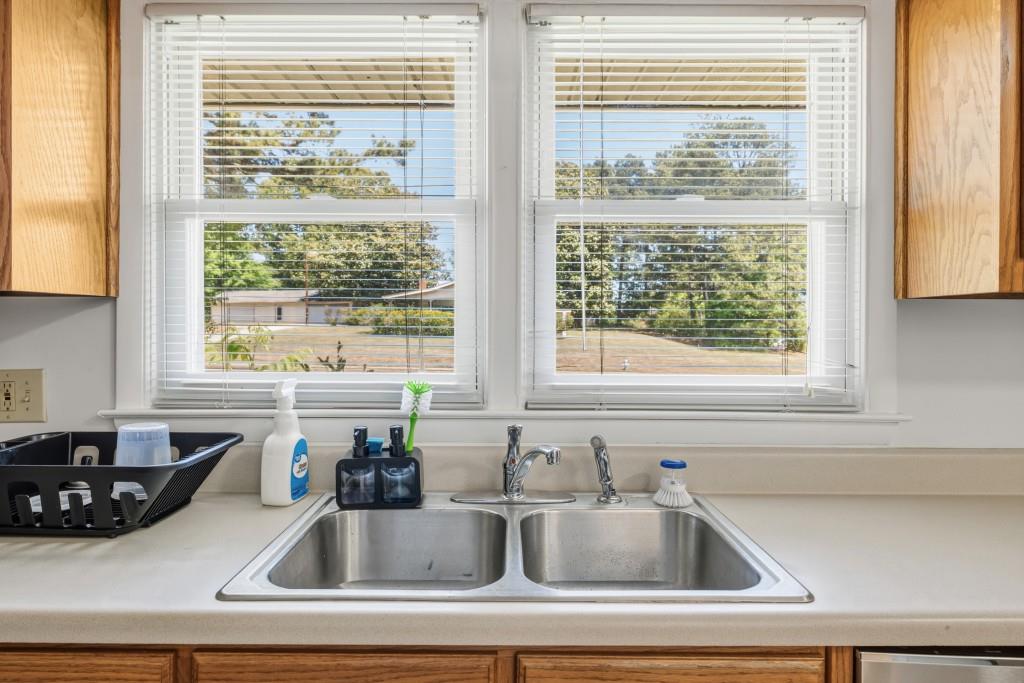 374 Dacula Road Dacula, GA 30019 - Photo 11 of 20 a kitchen sink with a window and cabinets